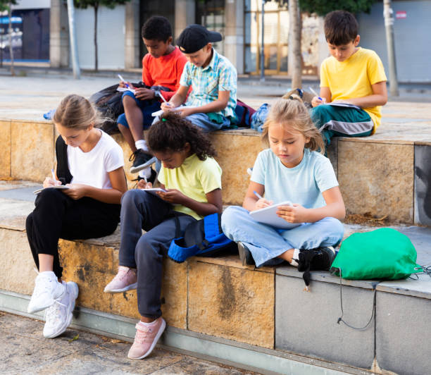istock Group of kids having open air lesson 1324825209