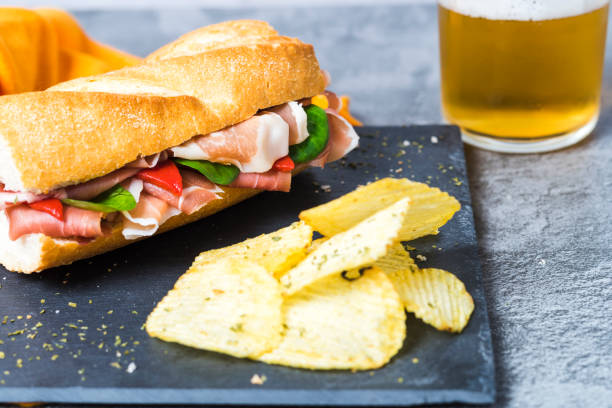 istock Close up ciabatta sandwich with jamon serrano with cold beer 1324828213
