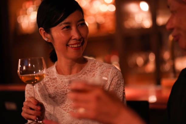 istock Couple drinking alcohol at the bar 1324829166