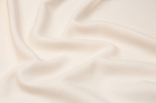 istock Smooth elegant ivory tissue abstract background. Textile background. Cloth wallpaper. Graphics design element 1324829314