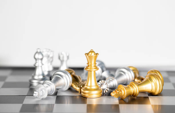 istock The gole queen chess surrounded by chess pieces , business strategy 1324829393