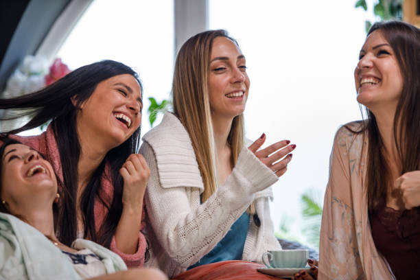 istock Girlfriends laughing together and having a bonding moment during slumber party 1324829464