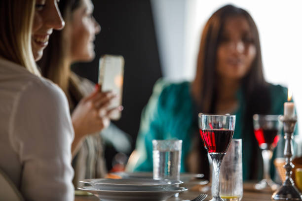 istock Small group of women having lunch together 1324830534
