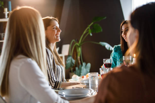 istock Girlfriends chatting and laughing during lunch together 1324830726