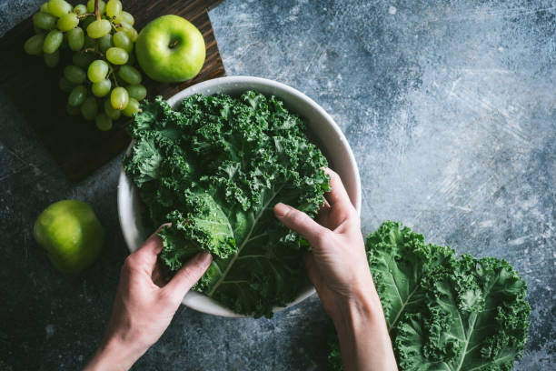 istock Kale cabbage and green fruits on concrete background 1324832050