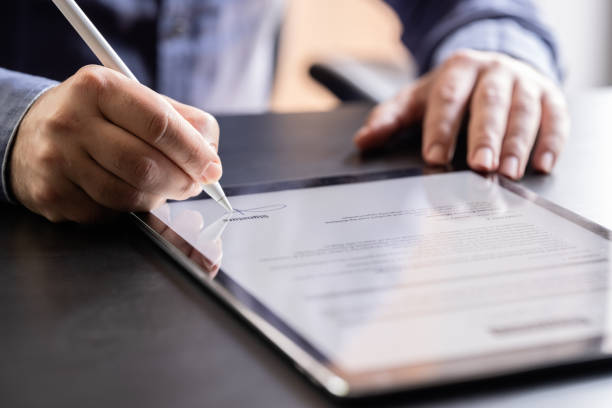 istock Man Signing The Digital Contract 1324835397