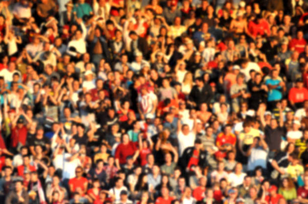 istock Blurred crowd of spectators in a stadium 1324835734