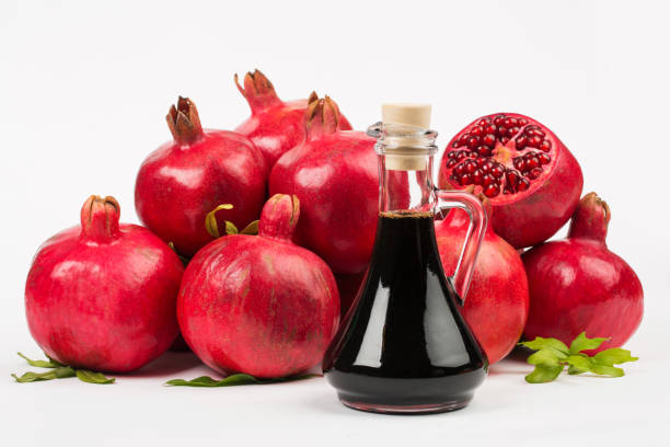 istock Grenadine and pomegranate on white background 1324835817