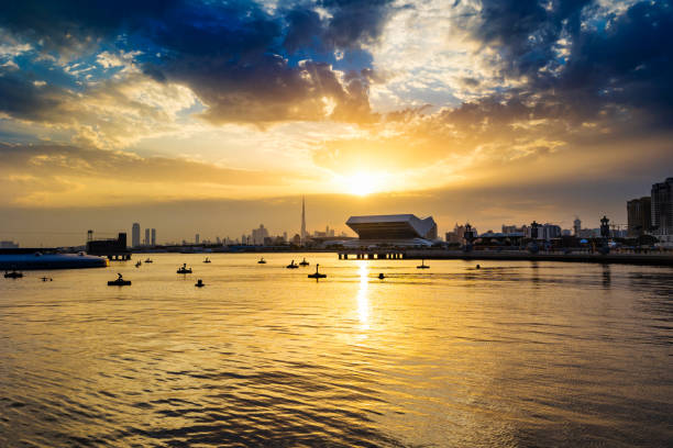 Beautiful Dubai city skyline panoramic view from Festival City in Dubai, United Arab Emirates. Dubai skyline in the evening or sunset with a colorful cloudy sky.
