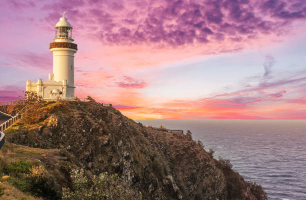 cape byron lighthouse in new south wales in australia at dramatic sunset - otway national park imagens e fotografias de stock