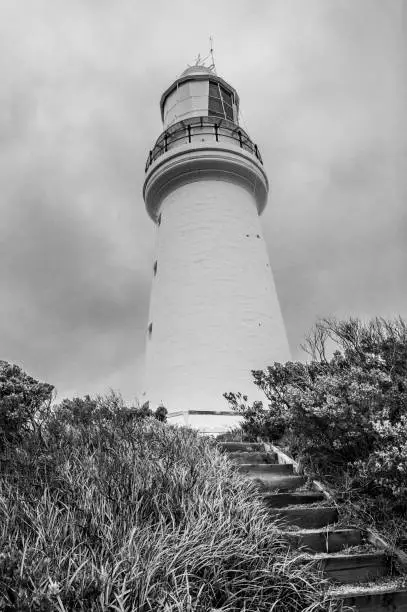 Famous Cape Otway Lightstation near the Great Ocean Road on southern coast of Victoria state, Australia. The oldest lighthouse in Australia