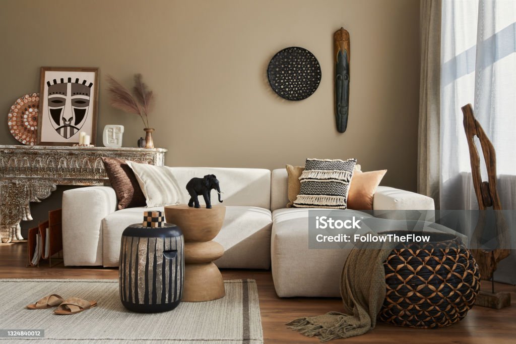 Stylish ethnic living room interior with design modular sofa. Stylish ethnic living room interior with design modular sofa, decoration and elegant personal accessories in modern home decor. Template. Home Decor Stock Photo