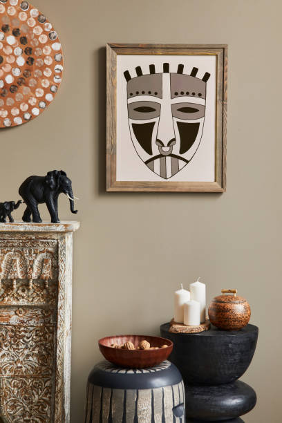 istock Stylish ethnic living room interior with mock up poster frame. 1324840242