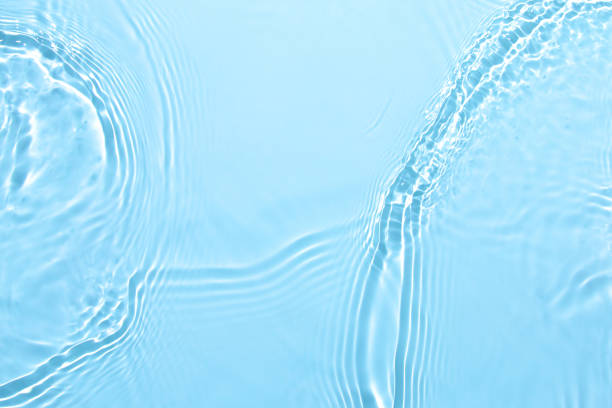 istock transparent blue colored clear calm water surface texture 1324840269