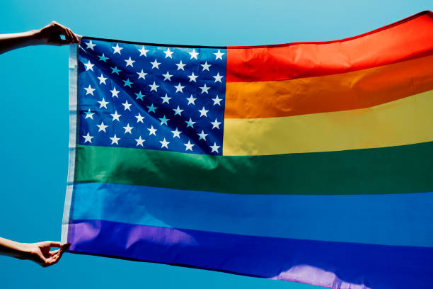 istock waves a rainbow US flag on the sky 1324841730