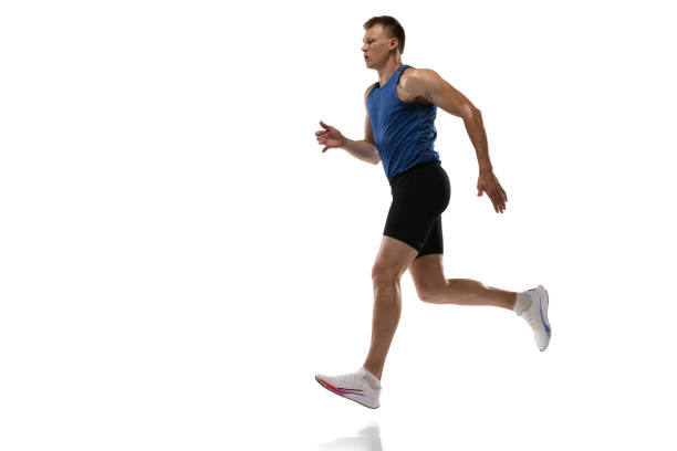 istock Caucasian professional male athlete, runner training isolated on white studio background. Muscular, sportive man. Concept of action, motion, youth, healthy lifestyle. Copyspace for ad. 1324842374