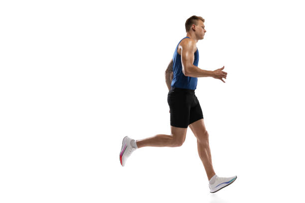 istock Caucasian professional male athlete, runner training isolated on white studio background. Muscular, sportive man. Concept of action, motion, youth, healthy lifestyle. Copyspace for ad. 1324842384