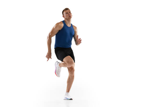 The runner's start. Caucasian professional male athlete, runner training isolated on white studio background. Muscular man. Concept of action, motion, youth, healthy lifestyle. Copyspace for ad.