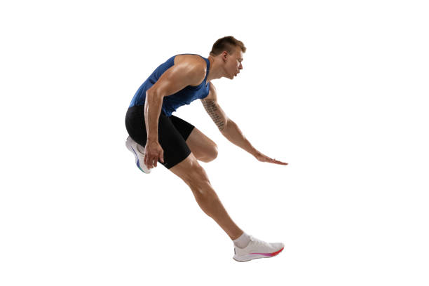 istock Athlete man athlete jumps over the barrier isolated on white background. 1324842399