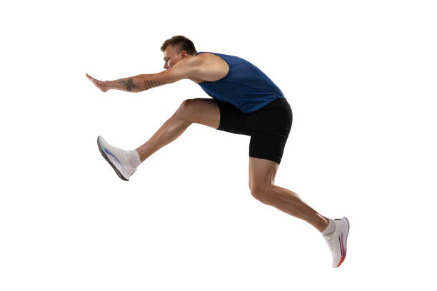 istock Athlete man athlete jumps over the barrier isolated on white background. 1324842404