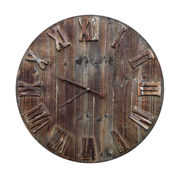 Old and wooden clock with the roman numerals isolated on white background Old and dirty wooden clock with the roman numerals isolated on white background color image roman numeral rusty time stock pictures, royalty-free photos & images