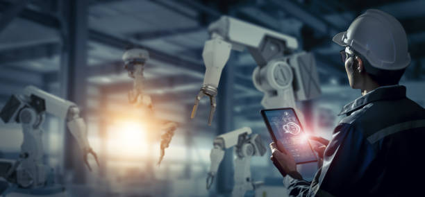 istock Engineer check and control robotics automatic arms machine in intelligent and smart factory automotive industrial on real time monitoring system software. Digital manufacturing operation. Industry 4.0 1324845292