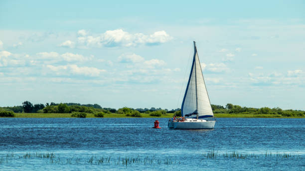 istock big white yacht sails upstream of the river 1324845503