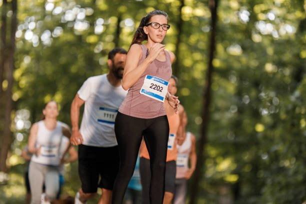 istock Determined sportswoman running a marathon in nature. 1324845747