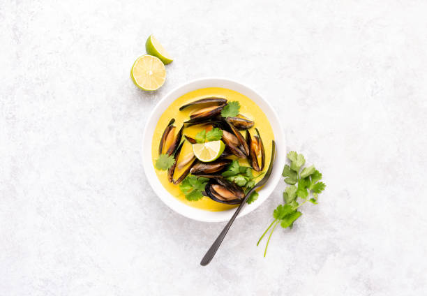istock Mussels in coconut cream curry sauce, top down view 1324846982