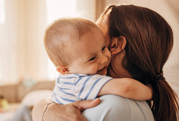 istock Mother hugging her little son 1324847036