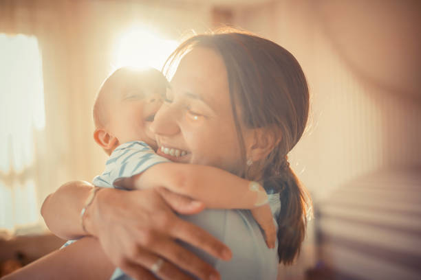 istock Mother hugging her little son 1324847088