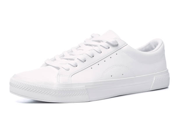 istock Pair of white leather trainers on white background 1324847219