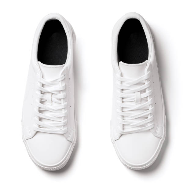 istock Pair of white leather trainers on white background 1324847228