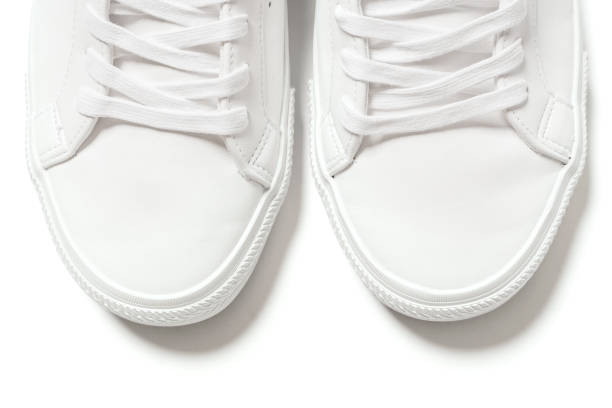 istock Pair of white leather trainers on white background 1324847270
