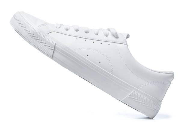istock Trainers - white leather shoe on white background 1324847316