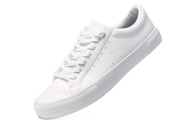 istock Trainers - white leather shoe on white background 1324847353