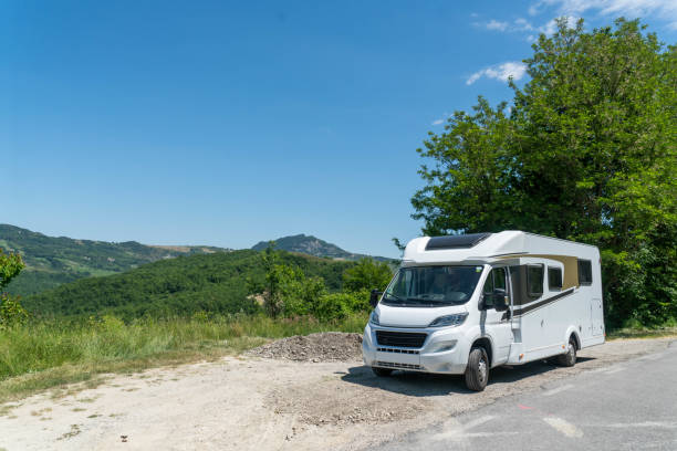 istock Campervan on deserted place with view on the Italian mountains 1324847515