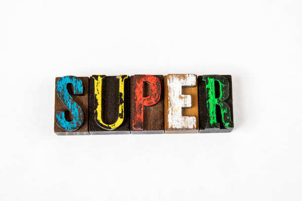 istock SUPER. Colored wooden alphabet letters on a white background 1324848188