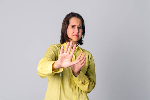 istock Disgusted teen girl refusing something awful, express aversion, squinting, cringe from reek, smell something bad 1324848315