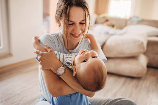 istock Mother hugging her little son 1324848473
