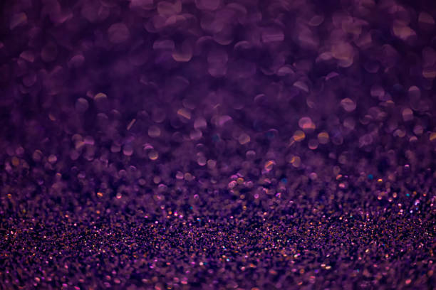 istock Texture of dark purple glitter dust surface, luxury background with bokeh 1324848572