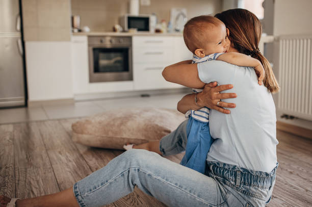 istock Mother hugging her little son 1324848963
