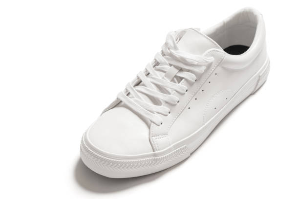 istock White leather shoe with a casted shadow on white background 1324848999