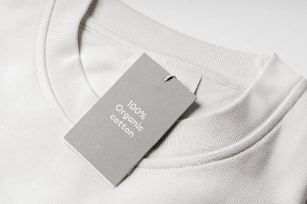istock Paper label on a white 100% organic cotton clothing 1324849956