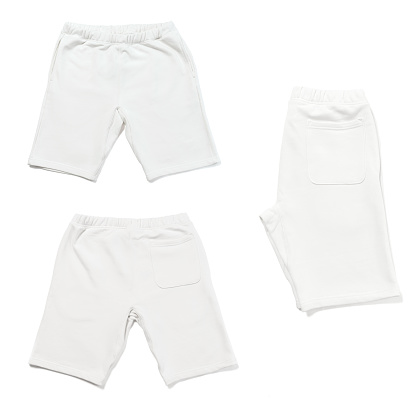 Different sides of white shorts isolated on white background