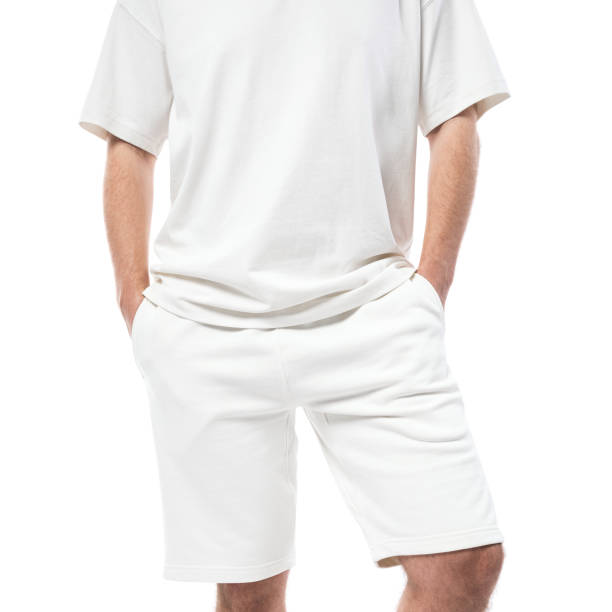 istock Man wearing blank white t-shirt and shorts on white background 1324851447