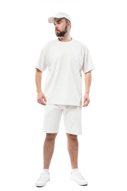 istock Man wearing blank white cap, t-shirt and shorts on white background 1324851636