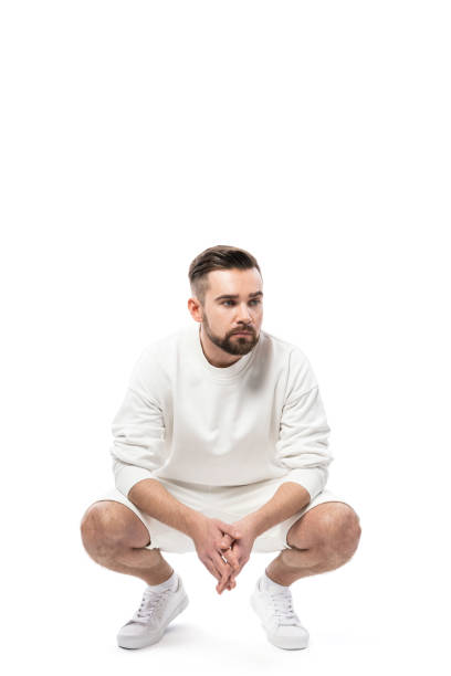 istock Handsome man wearing white sweatshirt and shorts on white background 1324851774