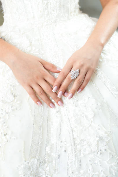 istock Bride's hands jewelry 1324852197