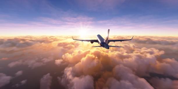 istock Commercial airplane flying towards the sun 1324853064